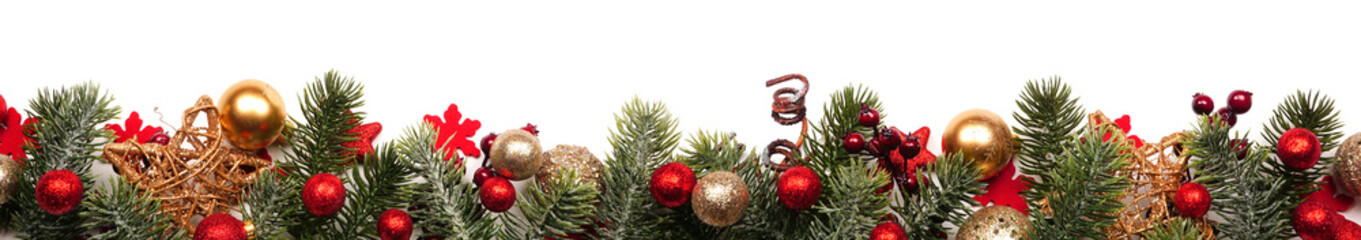 Long Christmas border banner of red and gold ornaments and branches isolated on a white background