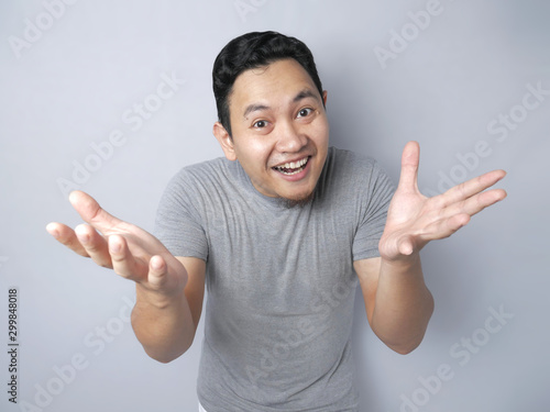 Asian Man Smiling With Open Arms