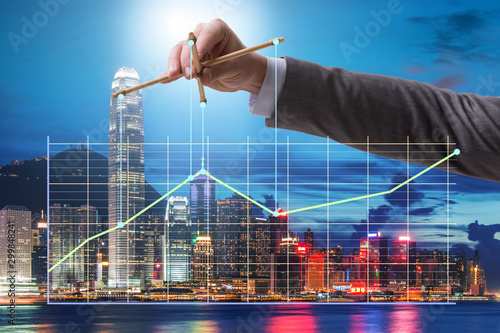 фотографія Businessman controlling the market with strings