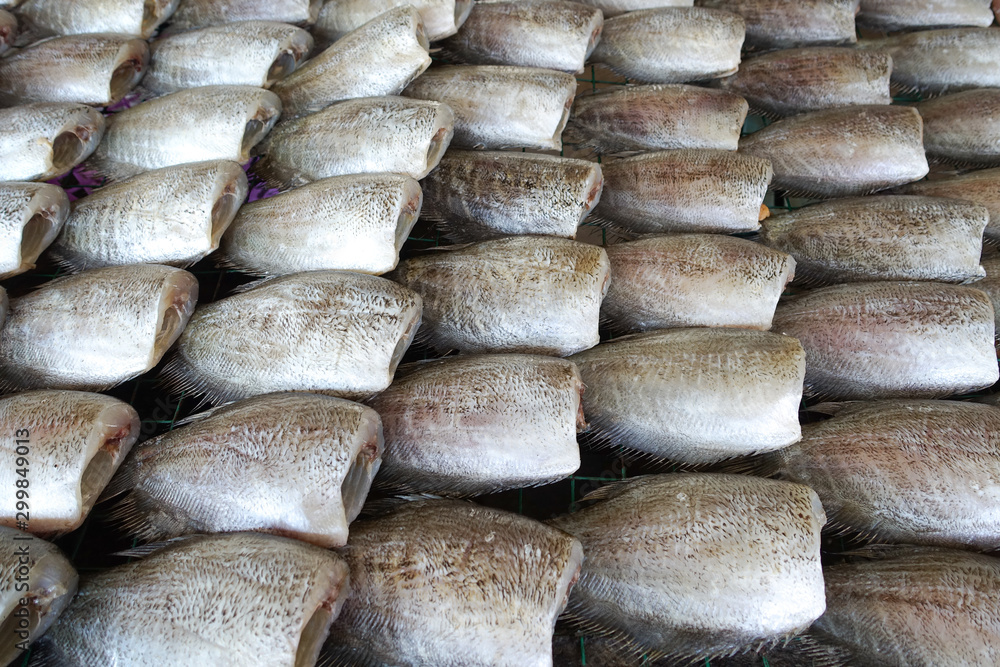 Gourami fish are processed by beheading and then dried in the sun.