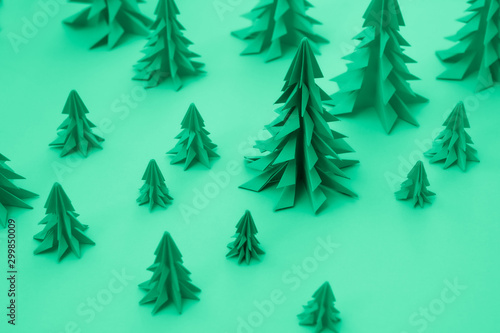Christmas trees made out of paper. DIY origami Christmas present. Toned into green color