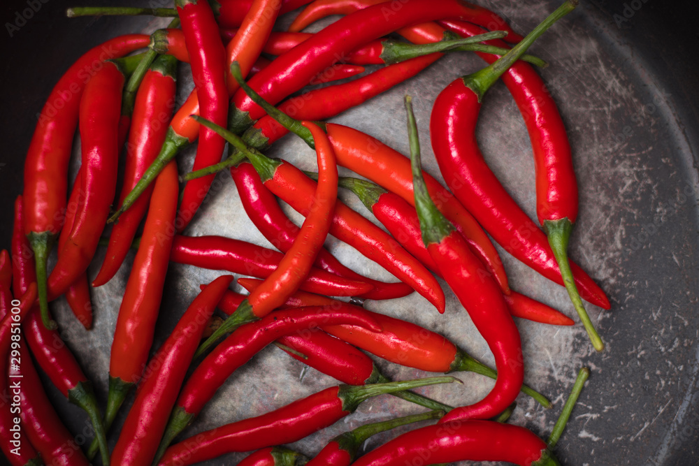 hot peppers, red peppers. A large amount of hot red chili pepper. Spicy, burning vegetable. Delicious food, pepper, vegetable, restaurant, dish
