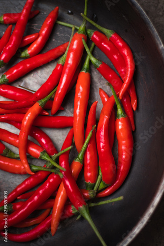 hot peppers, red peppers. A large amount of hot red chili pepper. Spicy, burning vegetable. Delicious food, pepper, vegetable, restaurant, dish