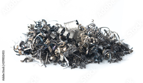 Pile of scrap metal shavings isolated on white background photo
