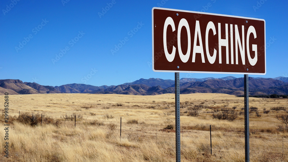 Coaching word on road sign