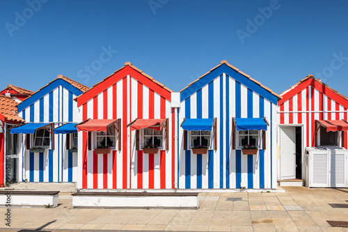 Colorful houses in Costa Nova, Aveiro, Portugal. Street with striped houses, Costa Nova, Aveiro, Portugal. Facades of colorful houses in Costa Nova, Aveiro, Portugal