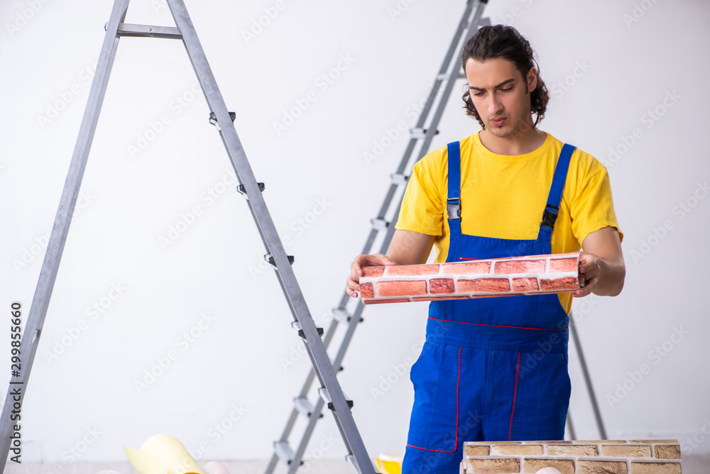 Young man contractor doing renovation at home