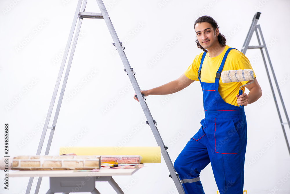 Young man contractor doing renovation at home Young man contractor doing renovation at home