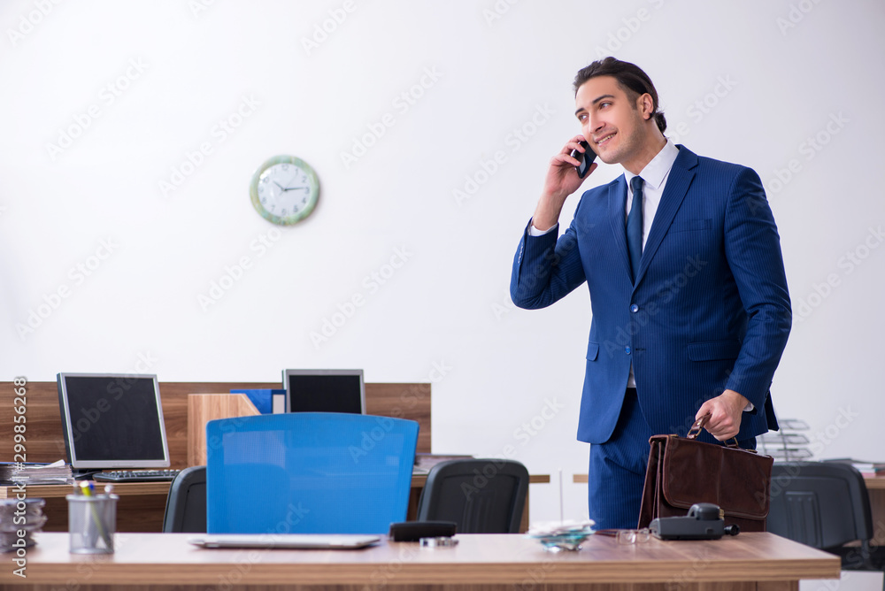 Young male businessman working in the office Young male businessman working in the office