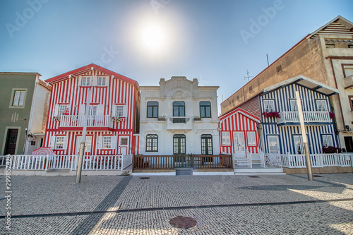 Street with colorful houses in Costa Nova, Aveiro, Portugal. Street with striped houses, Costa Nova, Aveiro, Portugal. Facades of colorful houses in Costa Nova, Aveiro, Portugal photo