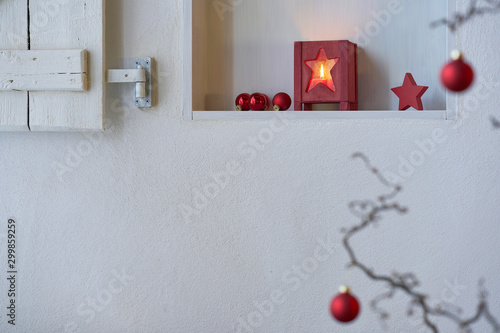 White wall, shelf and shutter with beautiful christmas decoration 