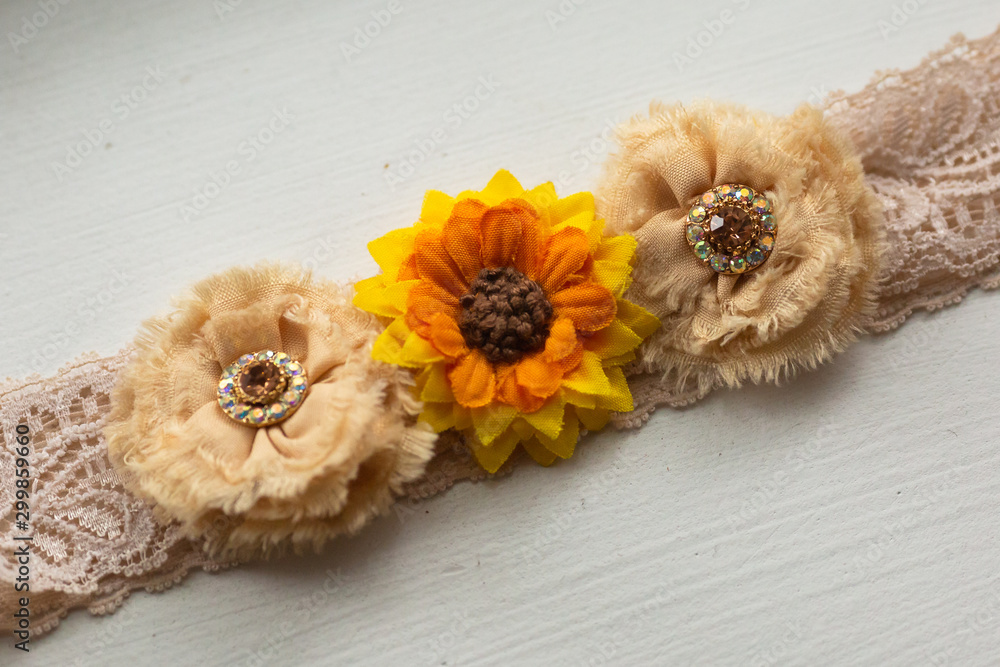 Sunflower garter detail of bridal garter for fall wedding Stock Photo |  Adobe Stock