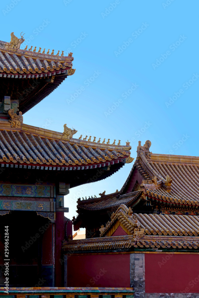 Naklejka premium ancient chinese architecture. historic buildings against the blue sky. beautiful traditional patterns. The Imperial Palace in Beijing