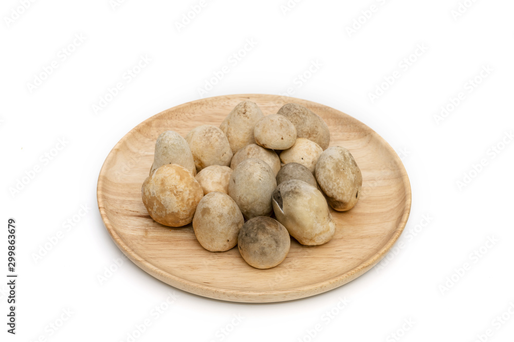 Straw mushroom on wooden dish,isolated on white background Straw mushroom on wooden dish,isolated on white background