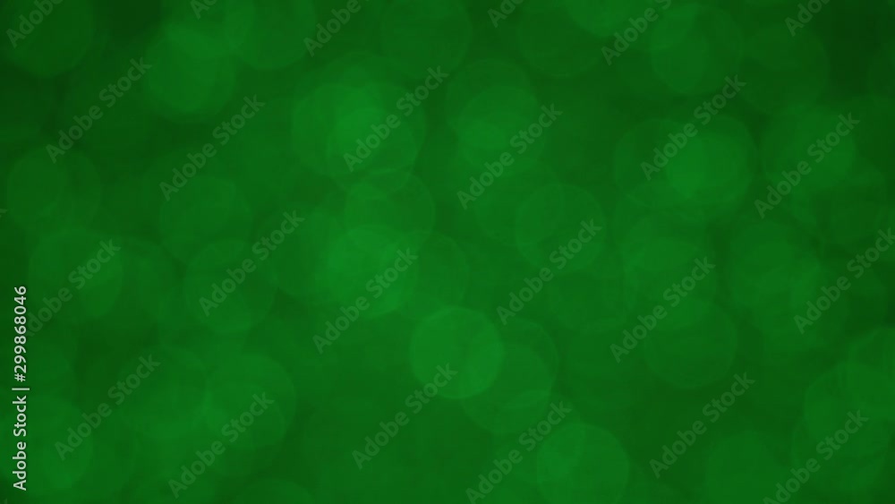 Spinning flickering green bokeh. Seamlessly looping background. Spinning flickering green bokeh. Seamlessly looping background.