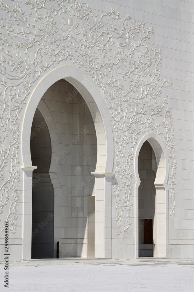 ornate marble walls and arch of grand mosque in abu dhabi uae 