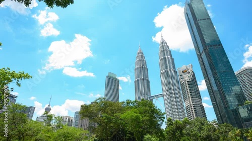 Time lapse video of the Petronas Twin Towers seen from the KLCC Park. The Petronas Towers are twin skyscrapers in Kuala Lumpur, Malaysia.