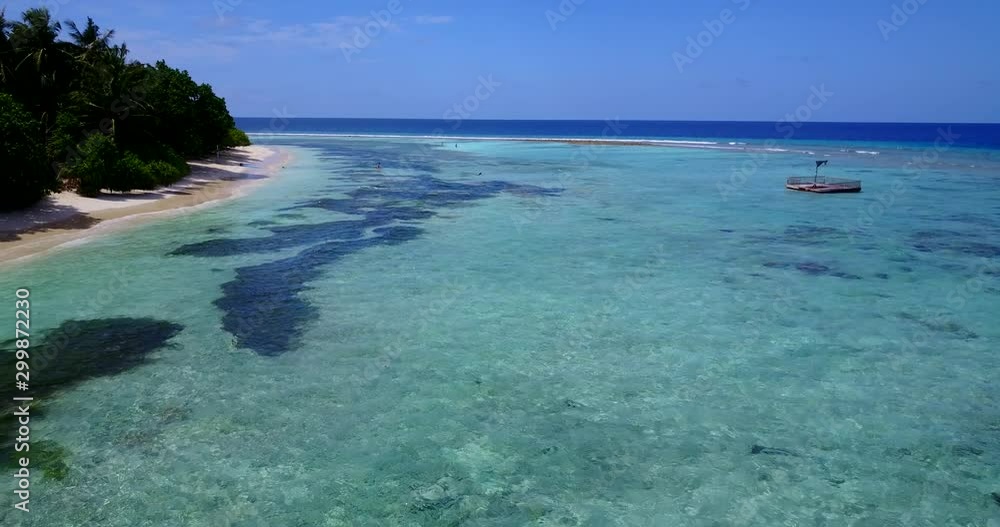 A Beautiful Tropical Seascape Of Bermuda's, white sand beach and wooden raft in crystal clear turquoise water A Beautiful Tropical Seascape Of Bermuda's, white sand beach and wooden raft in crystal clear turquoise water