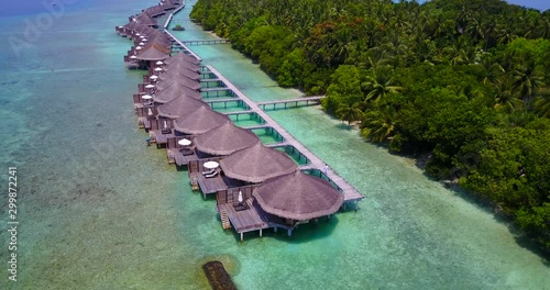 furanafushi island. Overwater bungalows and exotic trees palms,coral reef and luxury vacation photo