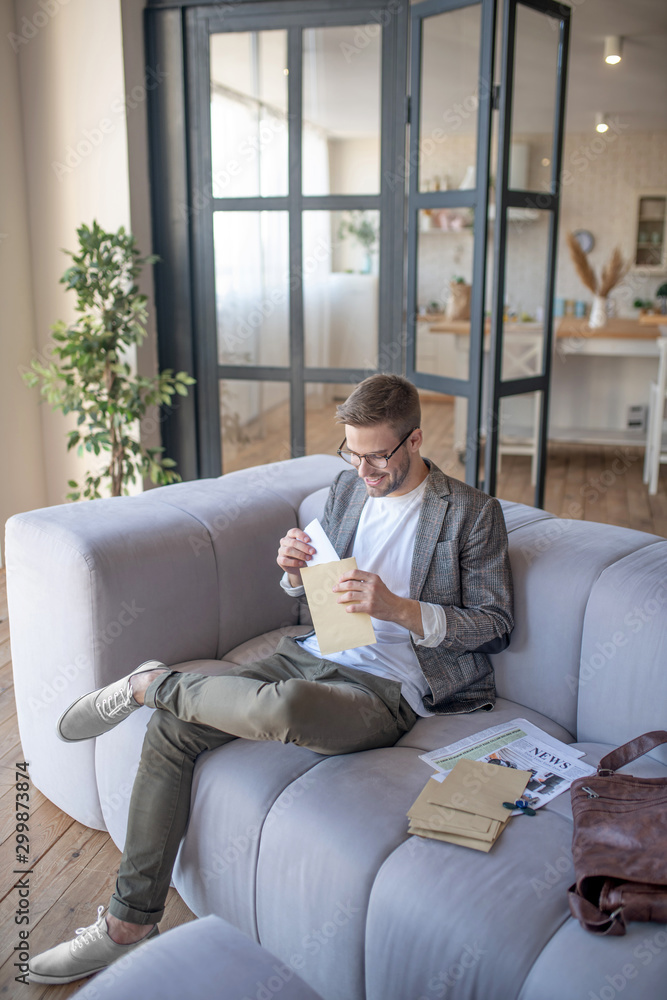 Top view of man sitting and reading letters in the morning Top view of man sitting and reading letters in the morning