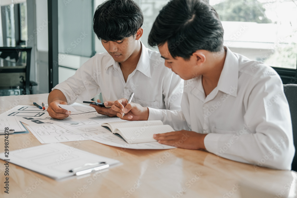 user experience UX designer designing web on smart phone layout. UI developer planning working on mobile application prototype user experience UX designer designing web on smart phone layout. UI developer planning working on mobile application prototype