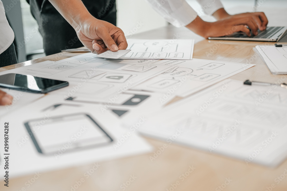 user experience UX designer designing web on smart phone layout. UI developer planning working on mobile application prototype user experience UX designer designing web on smart phone layout. UI developer planning working on mobile application prototype