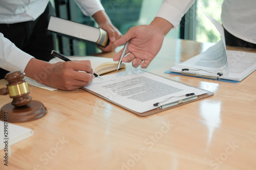 businessman consult lawyer & sign contract agreement. team meeting at law firm