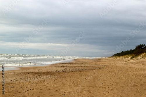 Stormy weather on the baltic sea beach with beautiful clouds