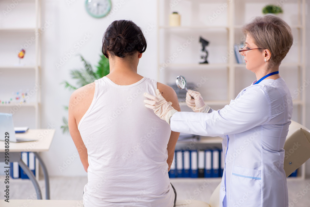 Fototapeta premium Young patient visiting doctor in hospital