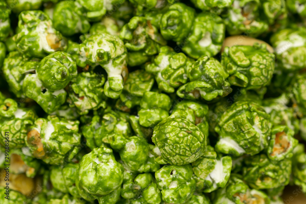 Lush of Japanese matcha green tea popcorn for texture background, Popular snack with favorite movie