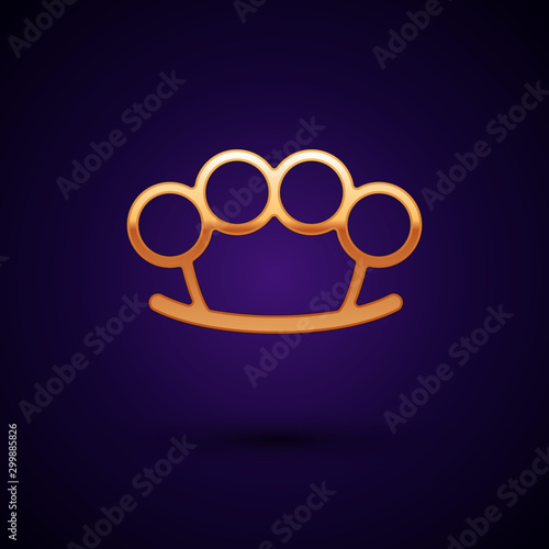 Gold Brass knuckles icon isolated on dark blue background. Vector Illustration