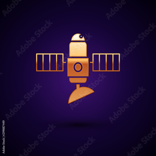 Gold Satellite icon isolated on dark blue background. Vector Illustration