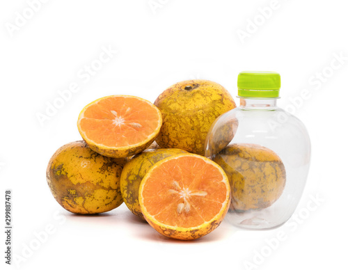 Fototapeta Naklejka Na Ścianę i Meble -  orange with empty plastic bottle isolated on the white background,Thai fruit