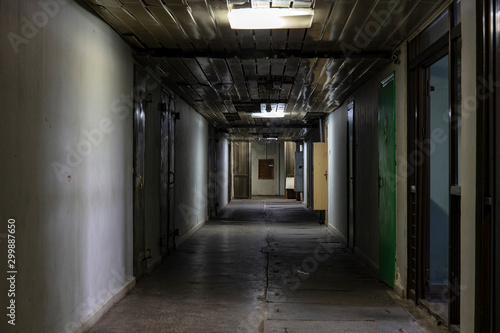 Long dark corridor in an old industrial building