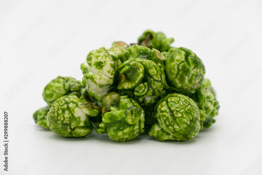 Fototapeta premium Lush of Japanese matcha green tea popcorn isolated on white background, Popular snack with favorite movie