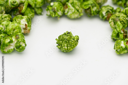 Lush of Japanese matcha green tea popcorn isolated on white background, Popular snack with favorite movie