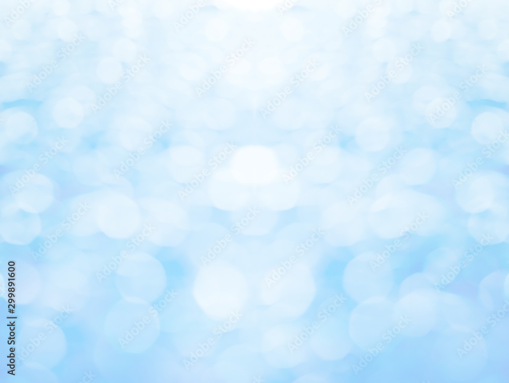 Abstract blurred and bokeh of droplets and reflection lighting on light blue background.