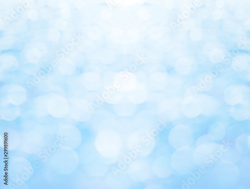 Abstract blurred and bokeh of droplets and reflection lighting on light blue background.