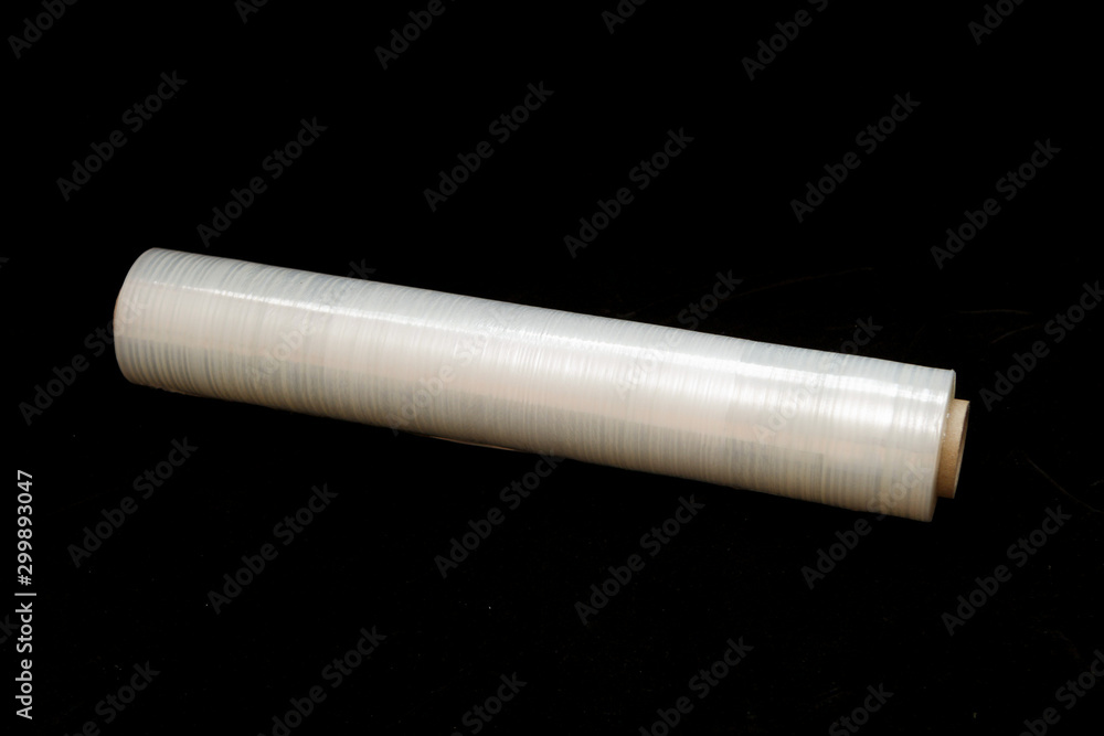 Roll of stretch film on a black background Roll of stretch film on a black background