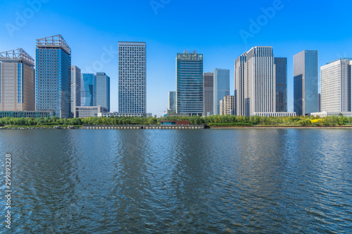 Business district office buildings and water reflection in Beijing .