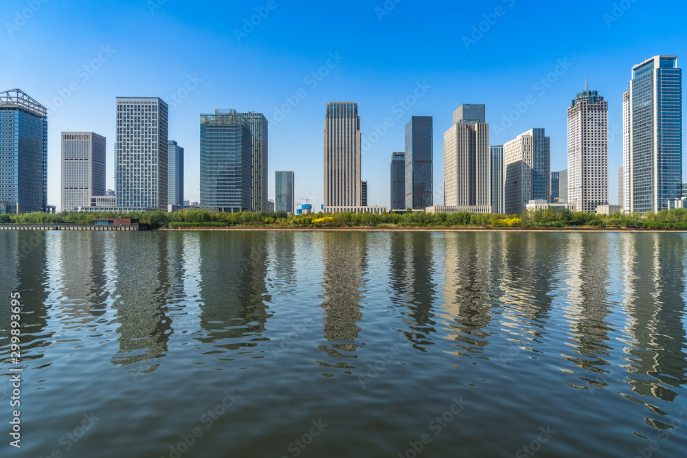 Fototapeta premium Business district office buildings and water reflection in Beijing .