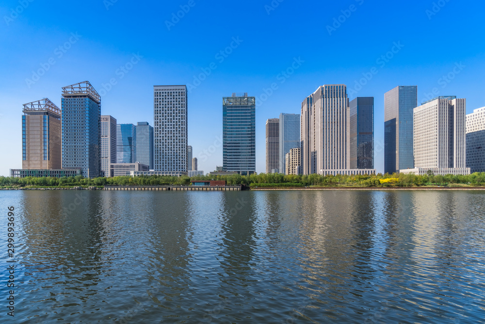 Fototapeta premium Business district office buildings and water reflection in Beijing .