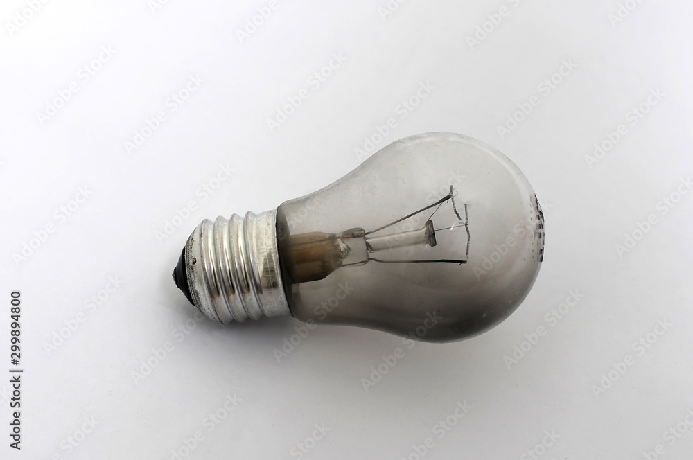 Burnt out light bulb on a white background Burnt out light bulb on a white background