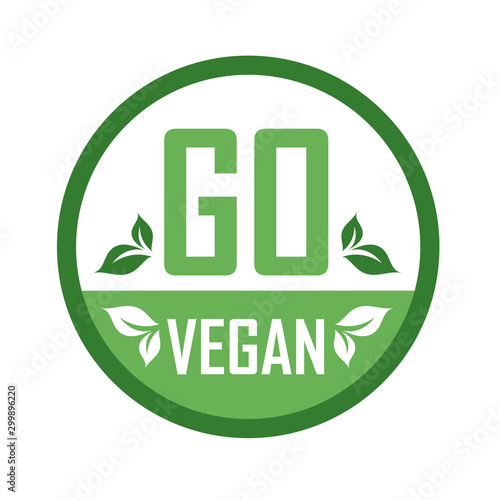 Go Vegan stamp symbol- Vegetarian food safety logo with green leaves photo