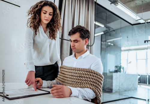 Canvas Print Business concept The employee does not want but must sign the document against his will