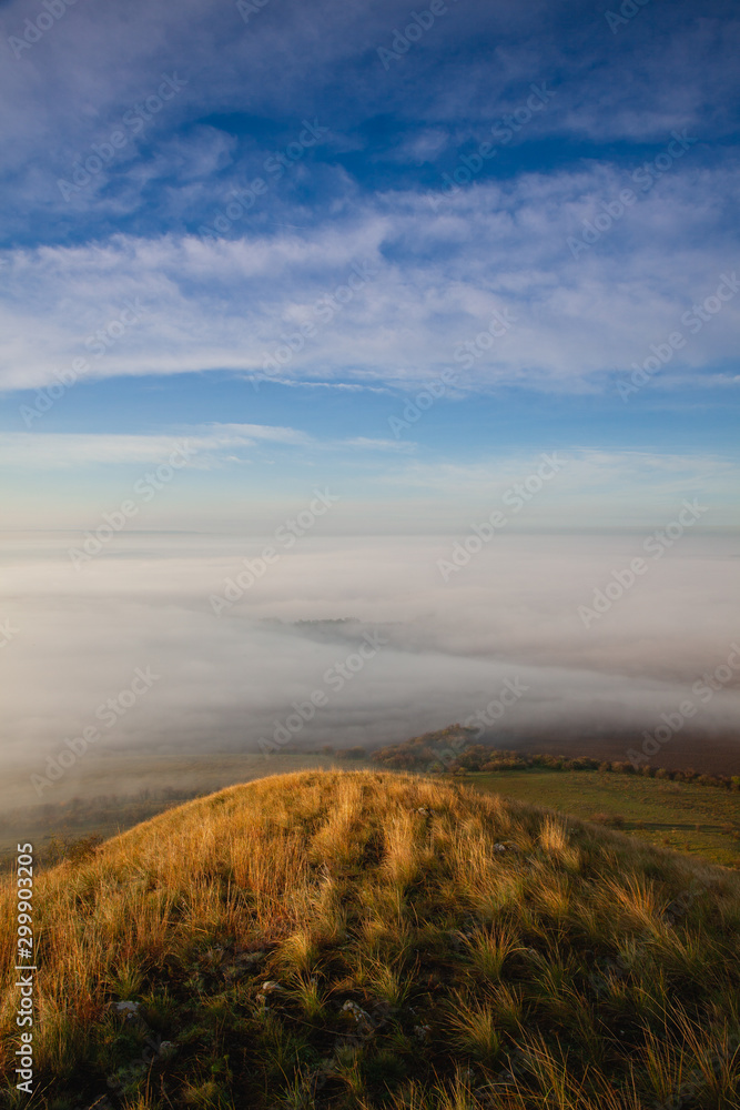View from Rana hill.Misty morning in Central Bohemian Highlands, Czech Republic. Central Bohemian Uplands  is a mountain range located in northern Bohemia. The range is about 80 km long