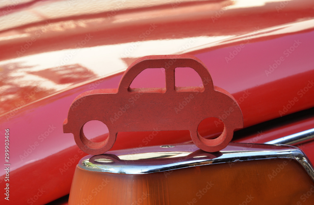 Naklejka premium handmade wooden miniature red toy car
