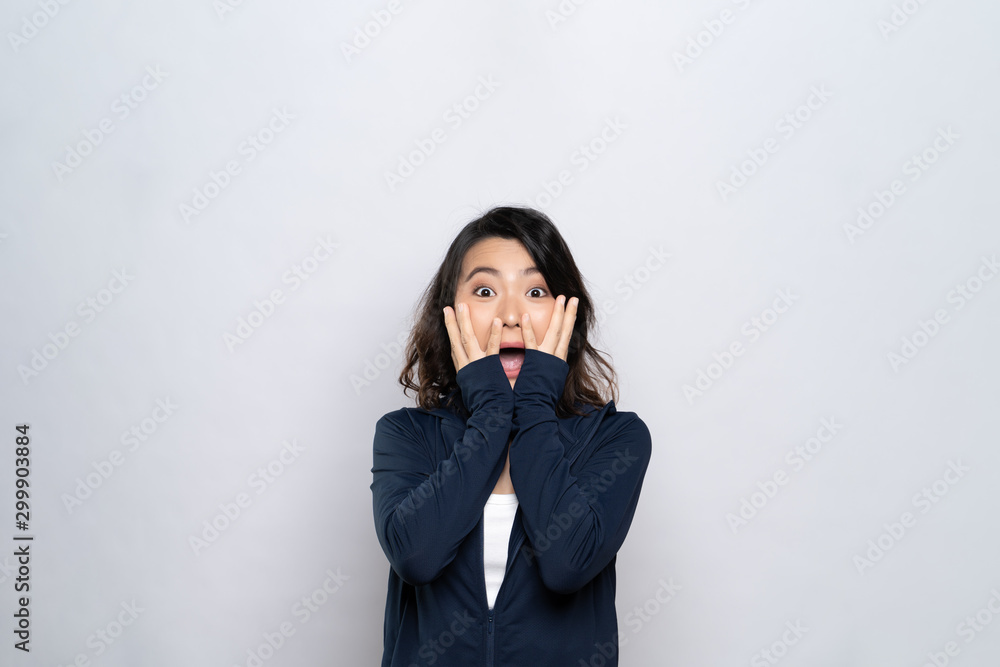 Woman feel scared standing isolated over white background Woman feel scared standing isolated over white background