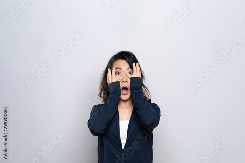 Woman feel scared standing isolated over white background