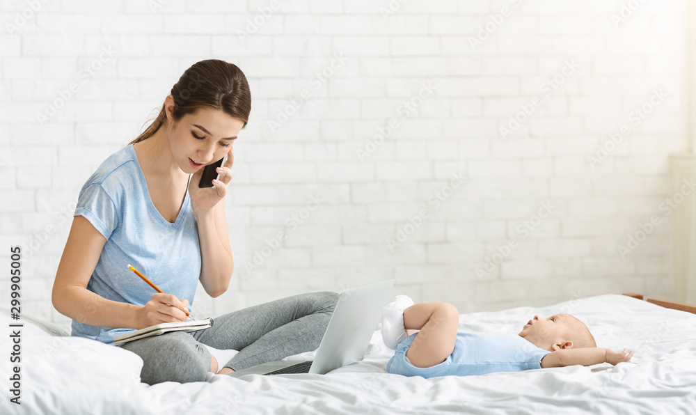 Young mother talking on phone arranging job interview Young mother talking on phone arranging job interview